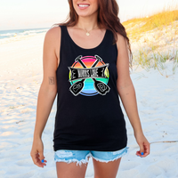 Woman wearing a black tank top with a colorful graphic on a beach