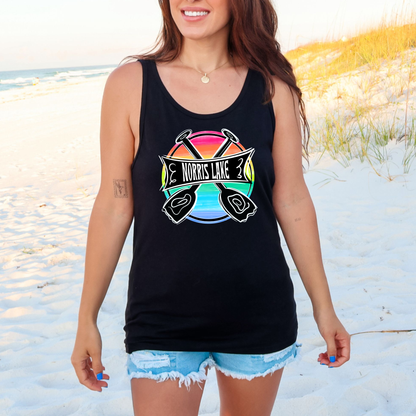 Woman wearing a black tank top with a colorful graphic on a beach