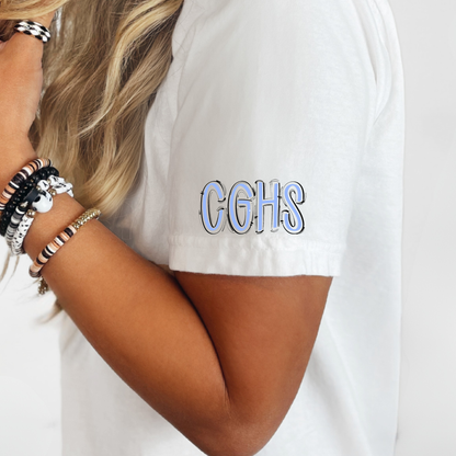 A close-up of a person wearing a white short-sleeve t-shirt with 'CGHS' printed on the sleeve in blue and white block letters with a black outline.